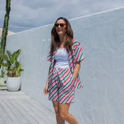 Jolly Stripe Christmas adult shorts with festive red, green, and white stripes; tropical holiday style. | Tropicool Clothing