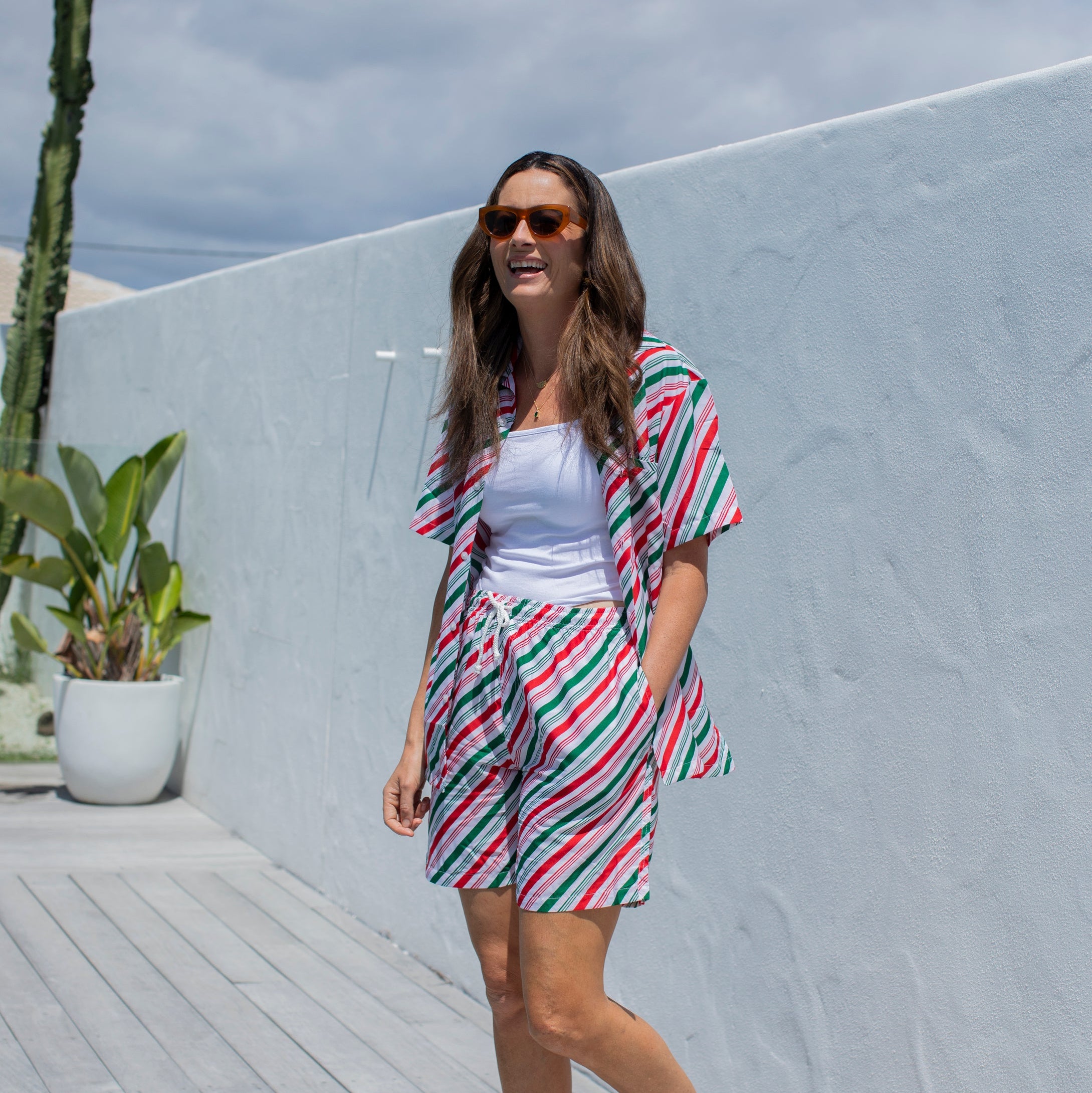 Jolly Stripe Christmas adult shorts with festive red, green, and white stripes; tropical holiday style. | Tropicool Clothing