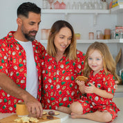 Matching red Christmas t-shirts with gingerbread man and holiday patterns; festive holiday apparel. | Tropicool Clothing
