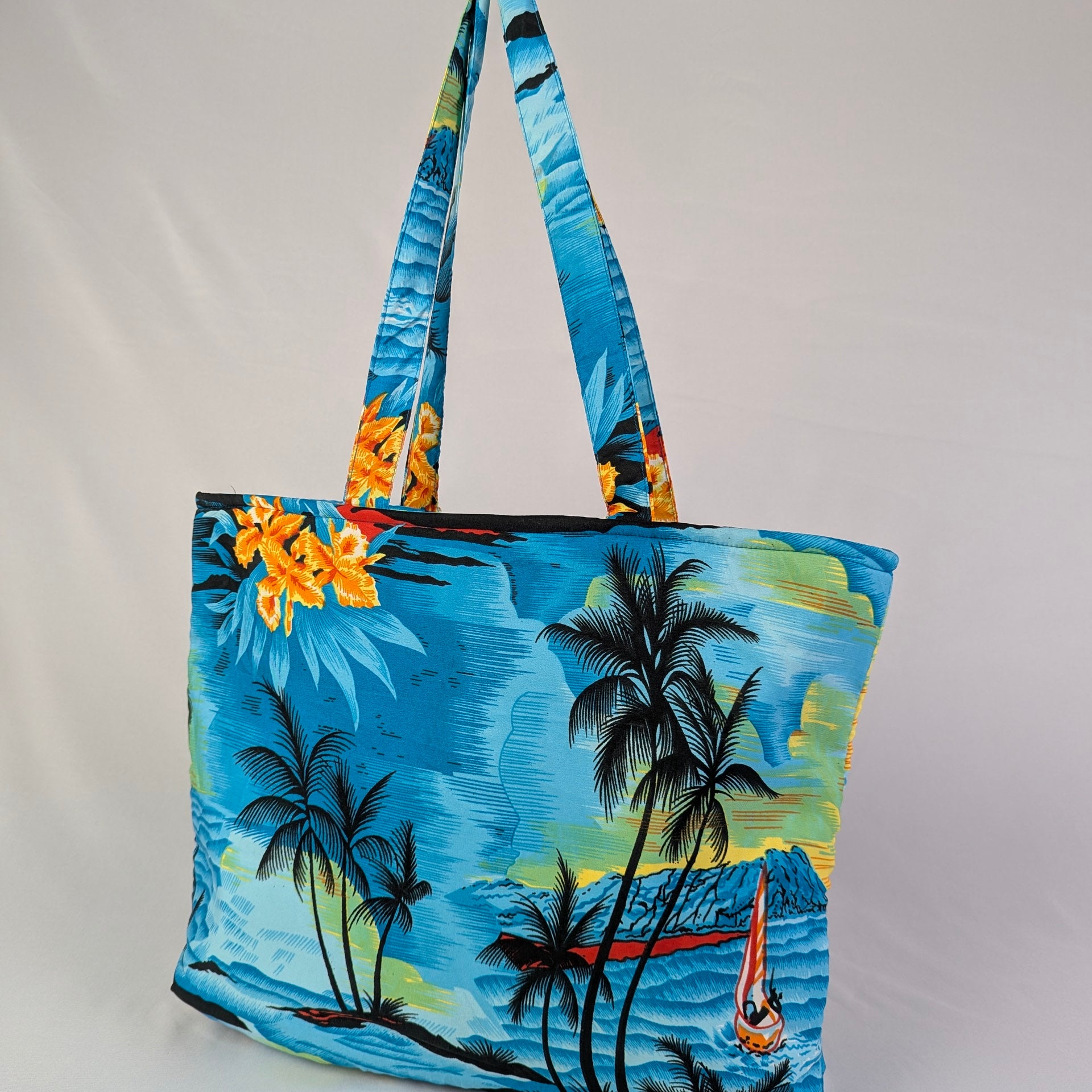 Tropicool Tote Bag with palm tree, ocean, sailboat prints and a colorful floral strap; tropical accessory. | Tropicool Clothing