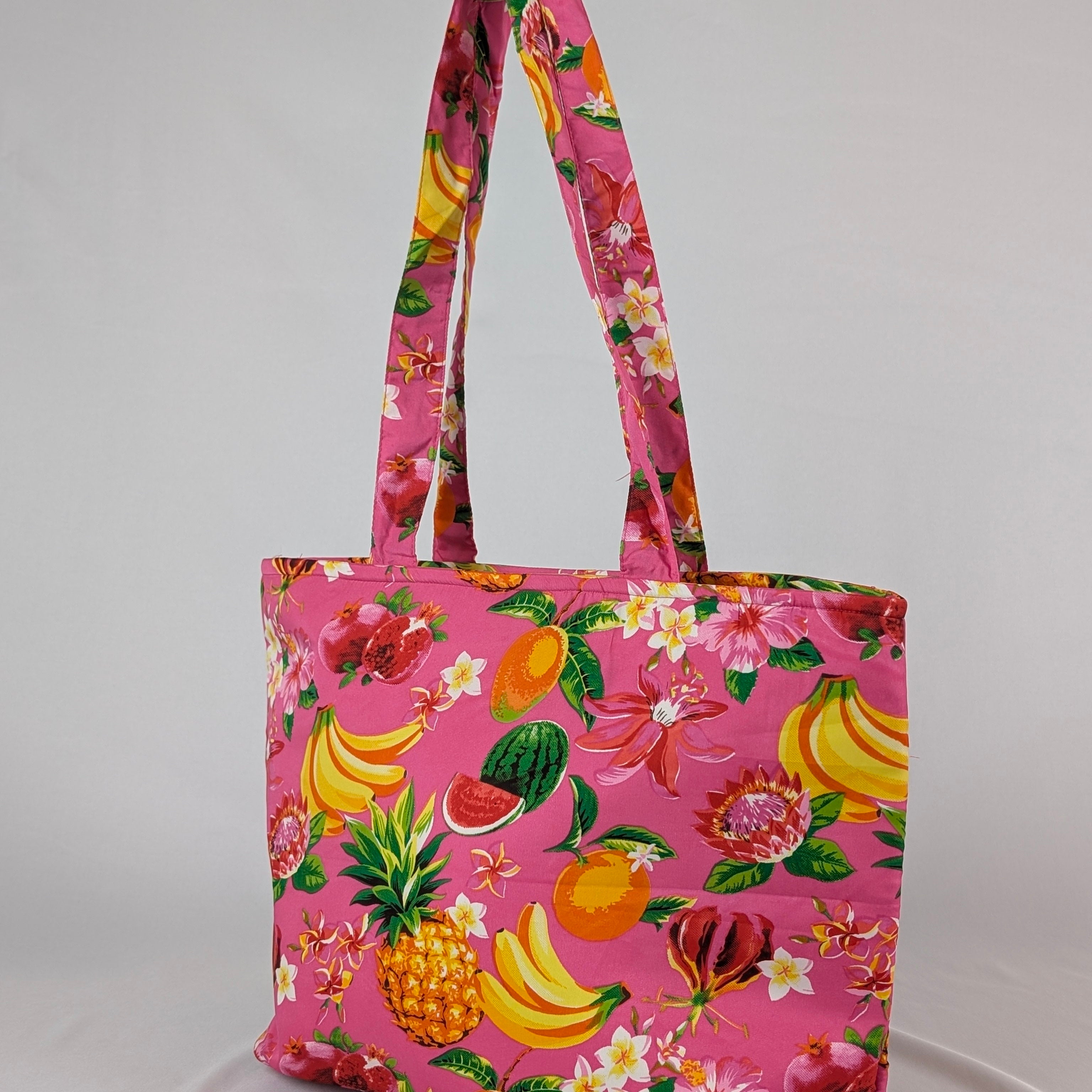 Tropicool Tote Bag with vivid tropical fruit and floral prints, ideal for festive beachwear style. | Tropicool Clothing