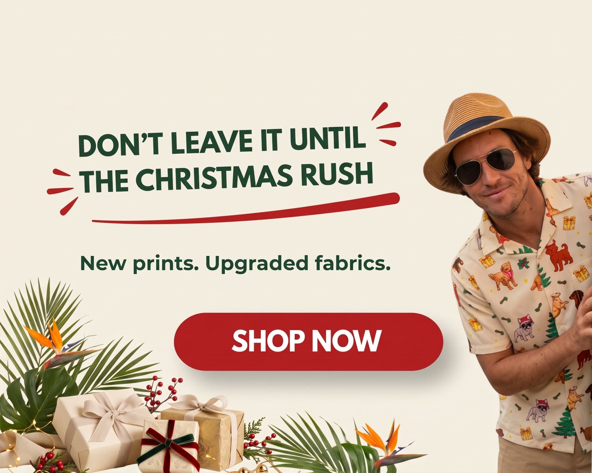 A promotional banner for a men's short-sleeve button-up shirt. On the right, a man wearing a straw hat, sunglasses, and the patterned shirt smiles next to a red 'SHOP NOW' button.