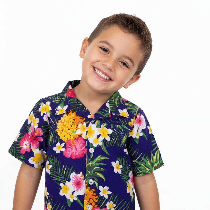 Child wearing a colorful floral shirt on a white background