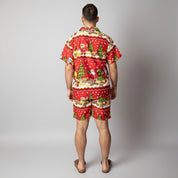 Back view of the Tropicool Happy Santa Red adult Christmas shirt and shorts set, featuring bold red festive prints with Santa and Christmas trees. Lightweight and comfortable for Aussie summer celebrations.
