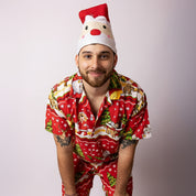A man standing in the Tropicool Happy Santa Red adult Christmas shirt and shorts set, showing the full front design with vibrant holiday prints. Ideal for Australian Christmas parties, BBQs, and family matching outfits