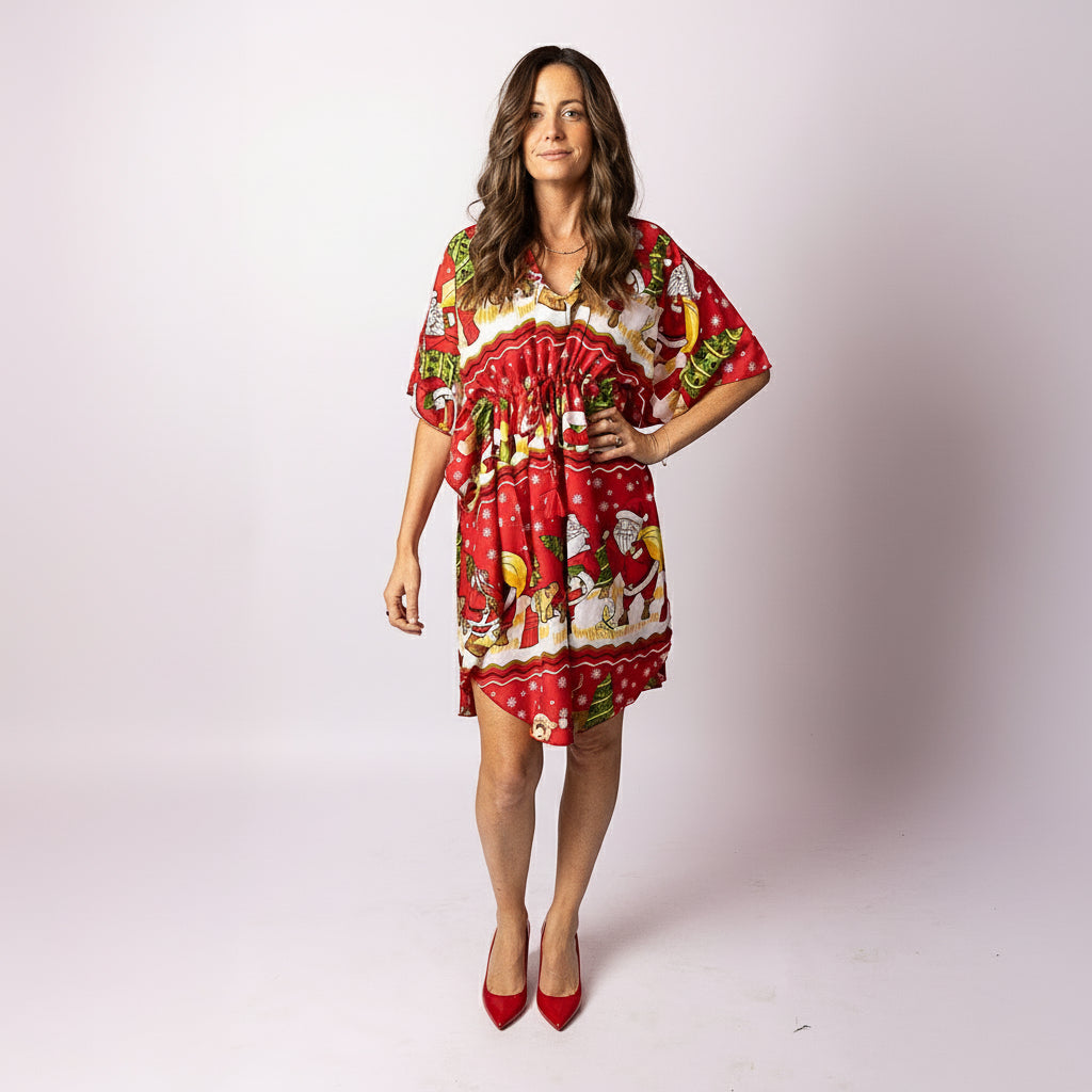 Woman wearing the Tropicool Happy Santa Red Kaftan with festive Christmas print, photographed front-on. Lightweight Aussie summer kaftan in inclusive sizing, perfect for holiday events.