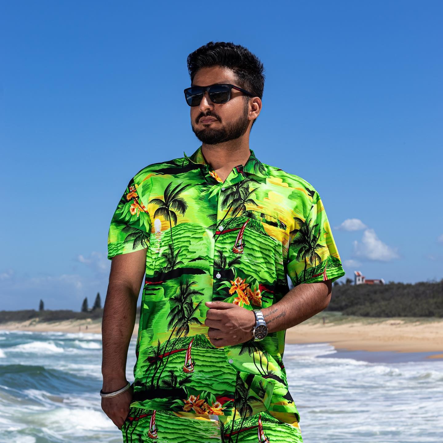 Sunset green adult Hawaiian shirt featuring tropical prints, festive style perfect for beachwear. | Tropicool Clothing