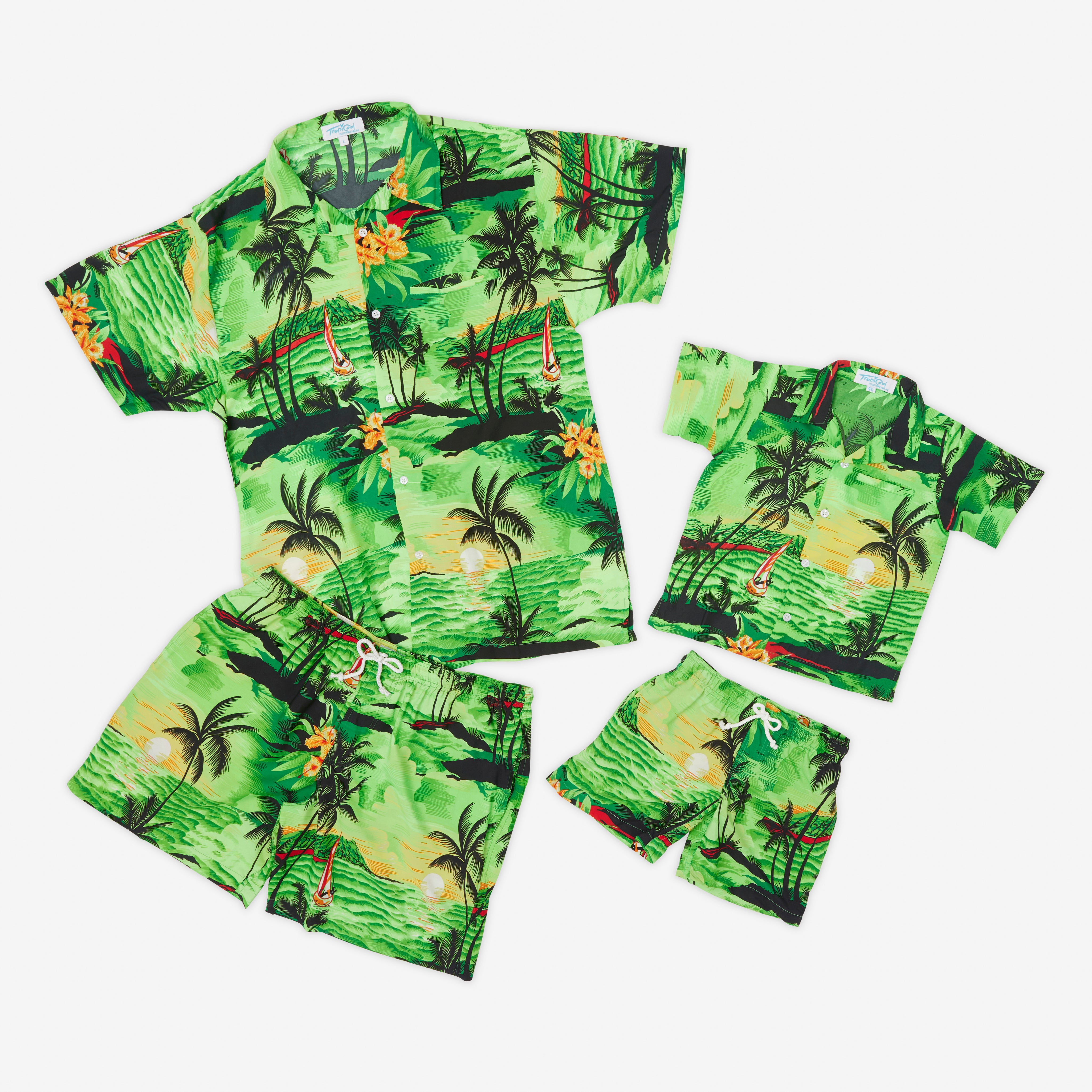 Green Hawaiian shirt and shorts set with sunset-toned palm tree print; tropical festive kids apparel. | Tropicool Clothing