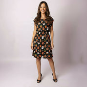 Full-body view of the Tropicool Alice JingleVerse Christmas adult dress in black, showing the festive rick and morty theme Perfect for matching family Christmas outfits.