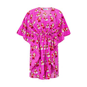 Pink kimono-style kaftan with white polka dots, festive cartoon women, and a drawstring waist. | Tropicool Clothing